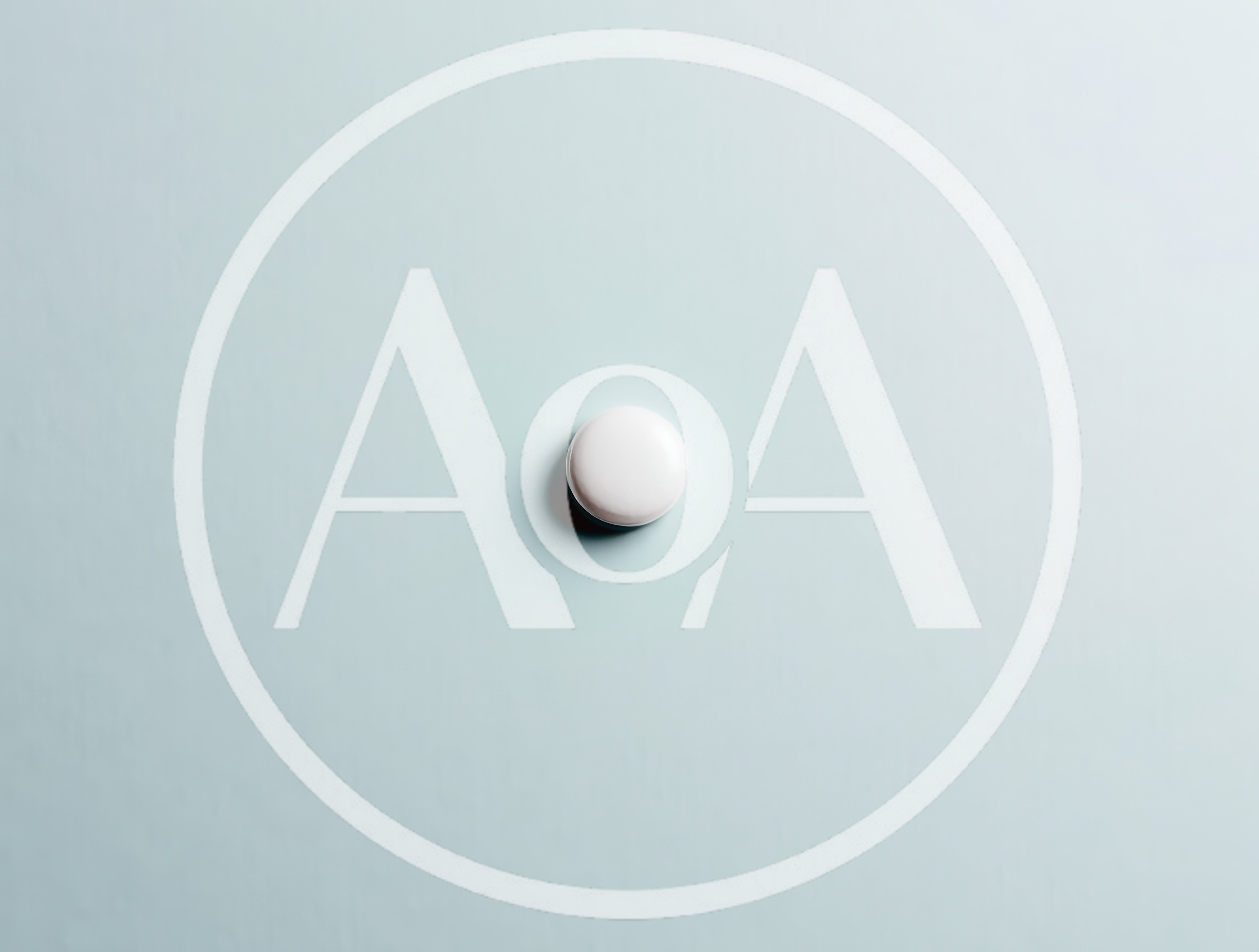 Single White Pill On A Light Blue Background