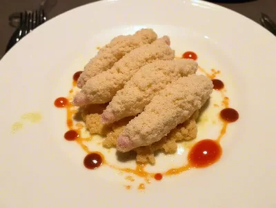 Gourmet Breaded Appetizer Plated On A White Plate