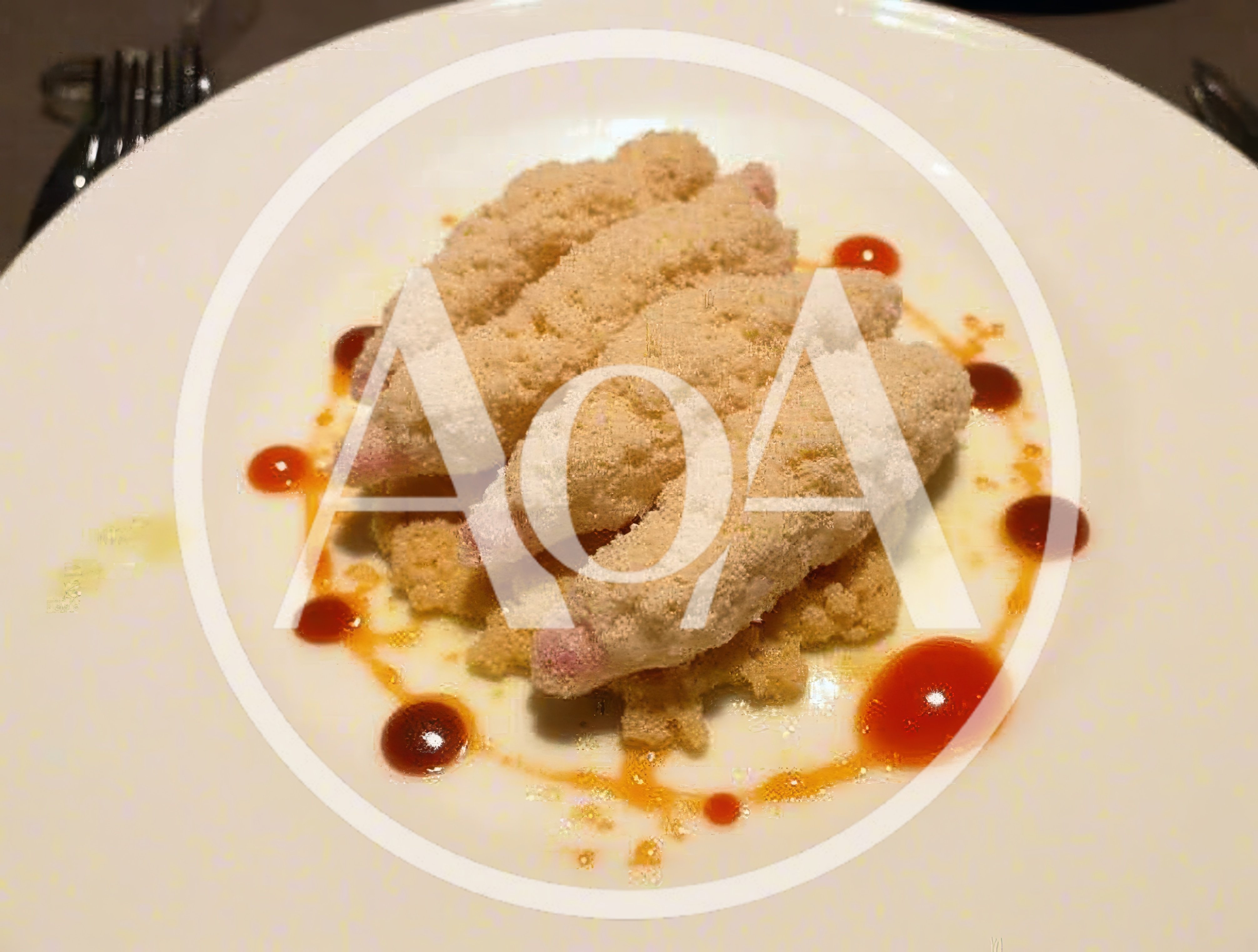 Gourmet Breaded Appetizer Plated On A White Plate