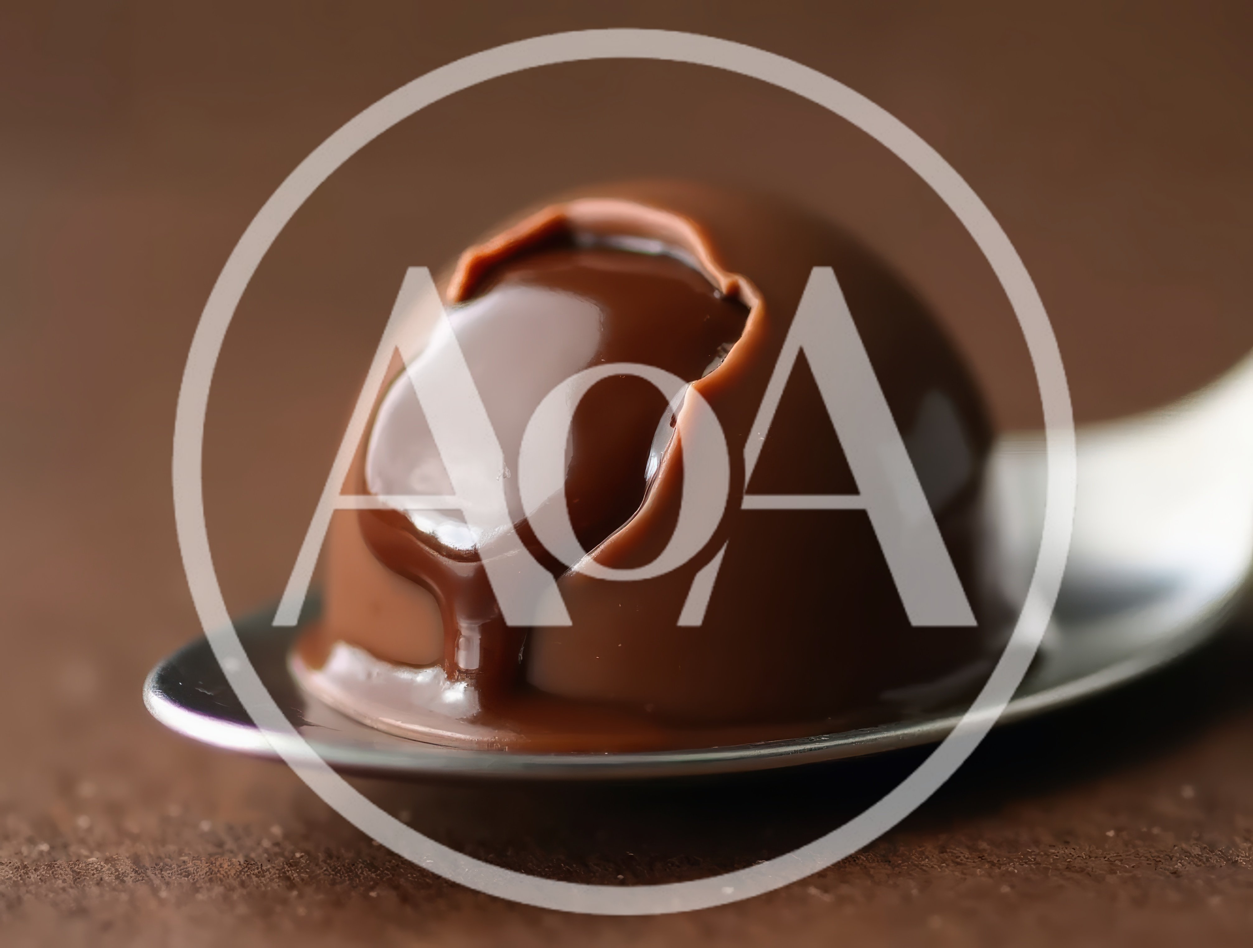 Chocolate Truffle With Liquid Filling On A Spoon