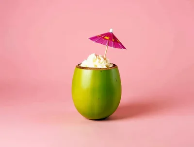 Coconut Cocktail With Whipped Cream And Umbrella