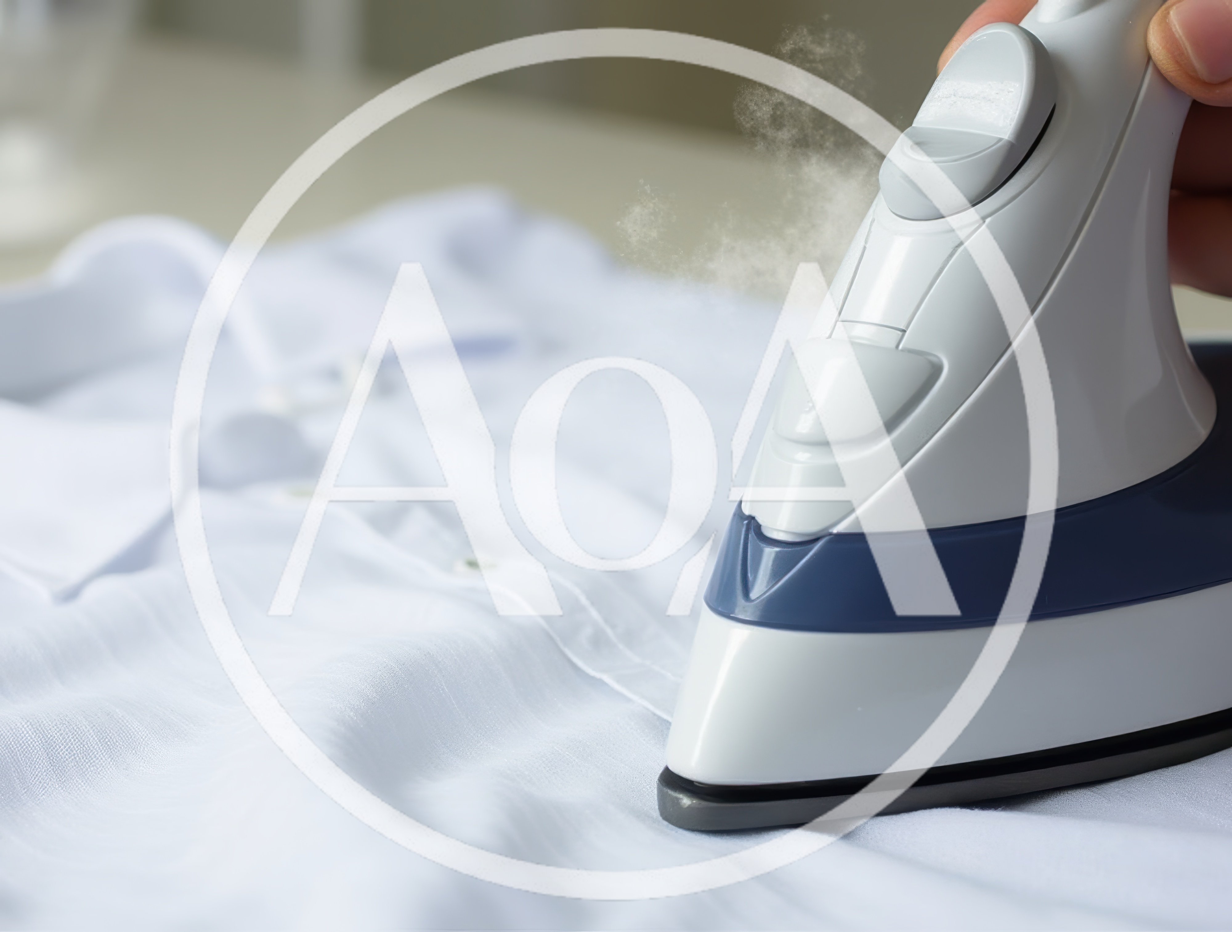 Hand Holding Steam Iron Pressing White Cotton Shirt
