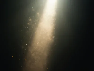 Golden Dust Particles Floating In A Bright Light Beam