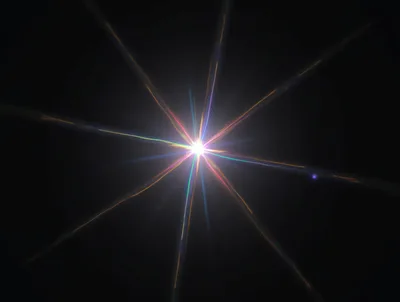 Bright Starburst Lens Flare Effect On Black Background