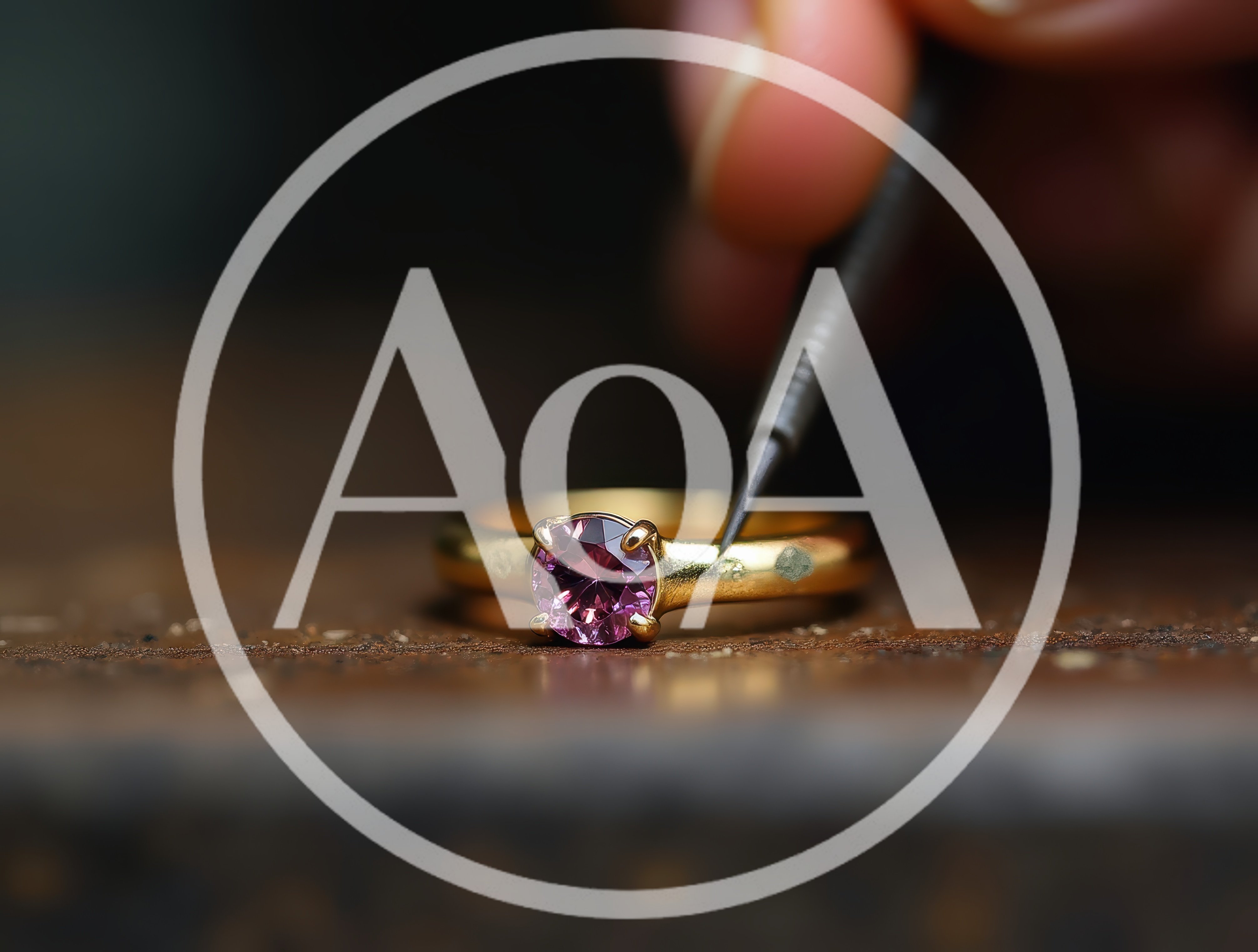 Jeweler Setting A Pink Gemstone Into A Gold Ring