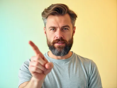 Man Pointing Finger At Camera With Serious Expression