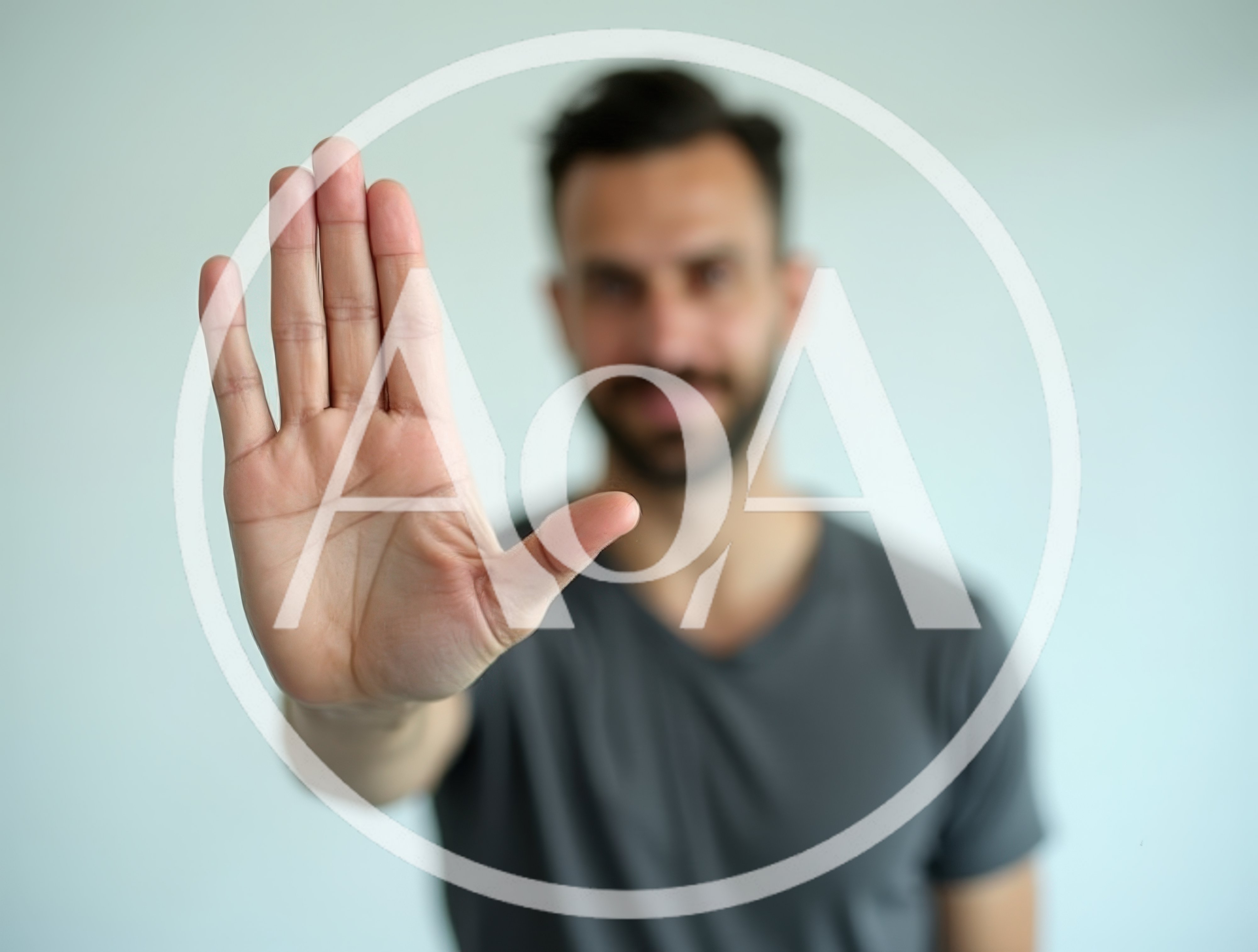 Man Holding Hand Up In Stop Gesture