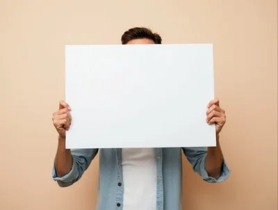 Man Holding Blank White Sign Over Face