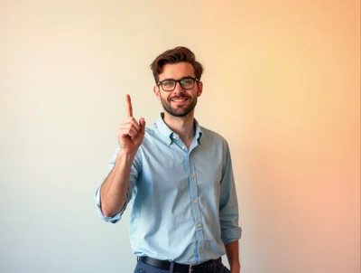 Young Man Pointing Upward With A Friendly Smile