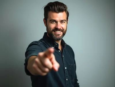Smiling Man Pointing Directly At Camera