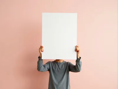 Person Holding Blank White Poster Board