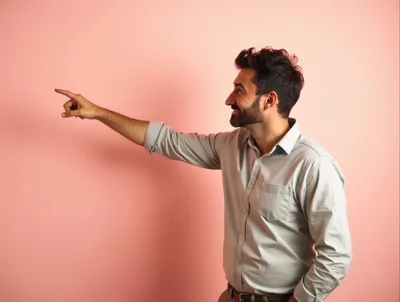 Man Pointing To The Side Against Pink Background