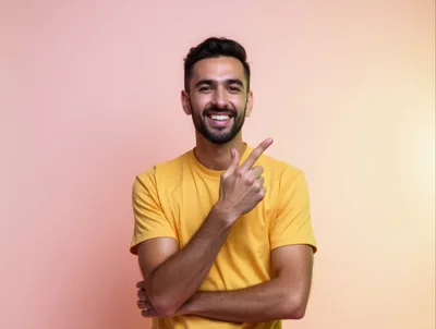 Smiling Young Man Pointing To The Side