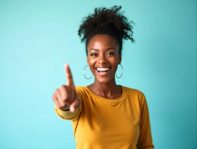 Happy Young Woman Pointing Forward At Camera
