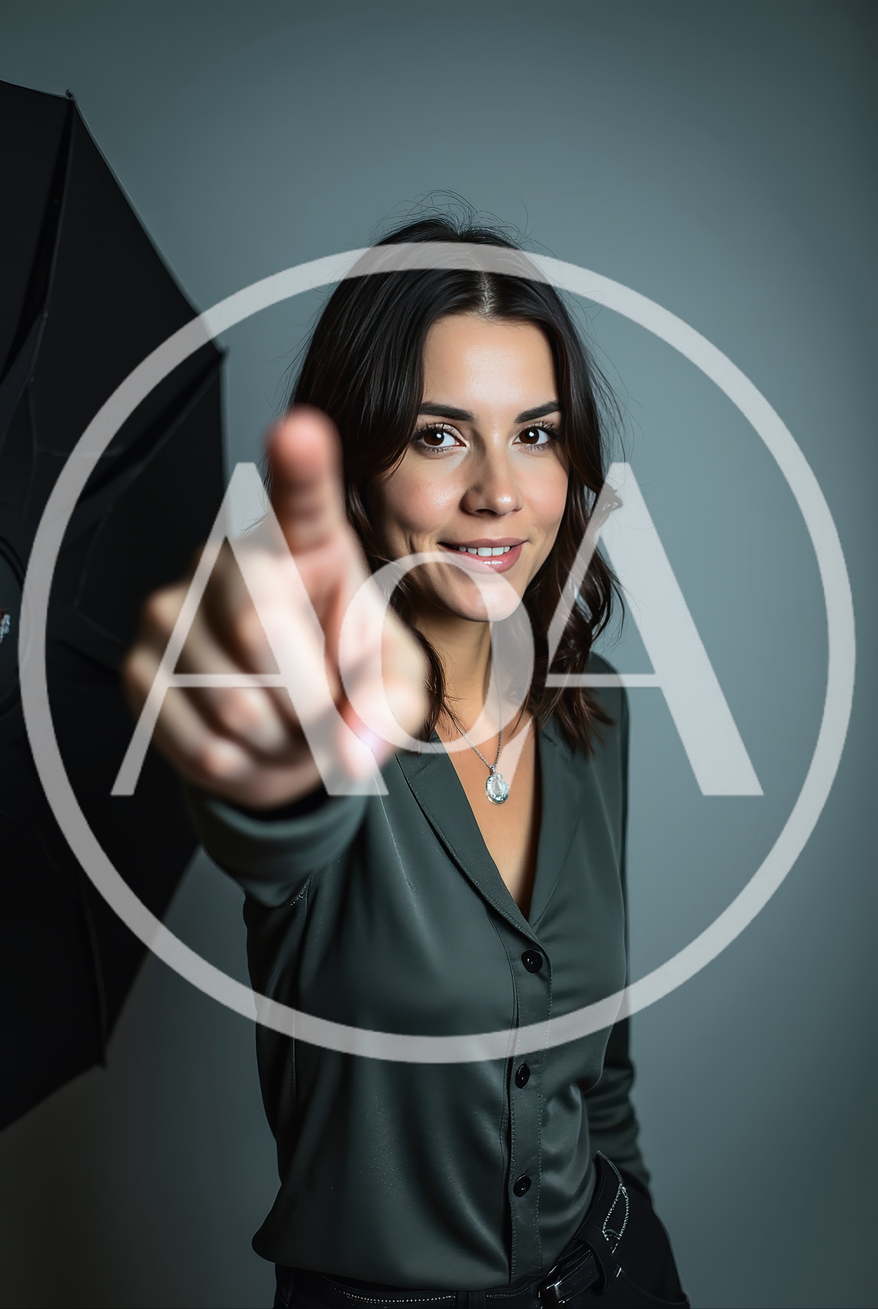 Young Woman Pointing Directly At Camera In Studio