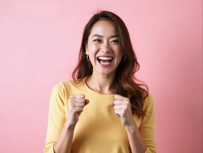 Excited Young Asian Woman Celebrating Success