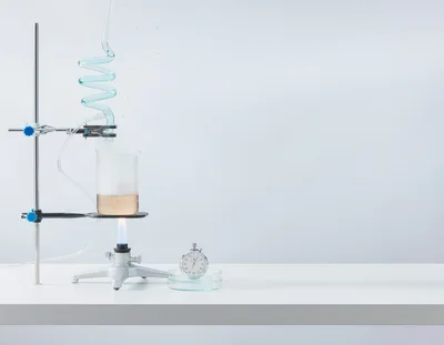 Laboratory Distillation Setup With Beaker And Stopwatch