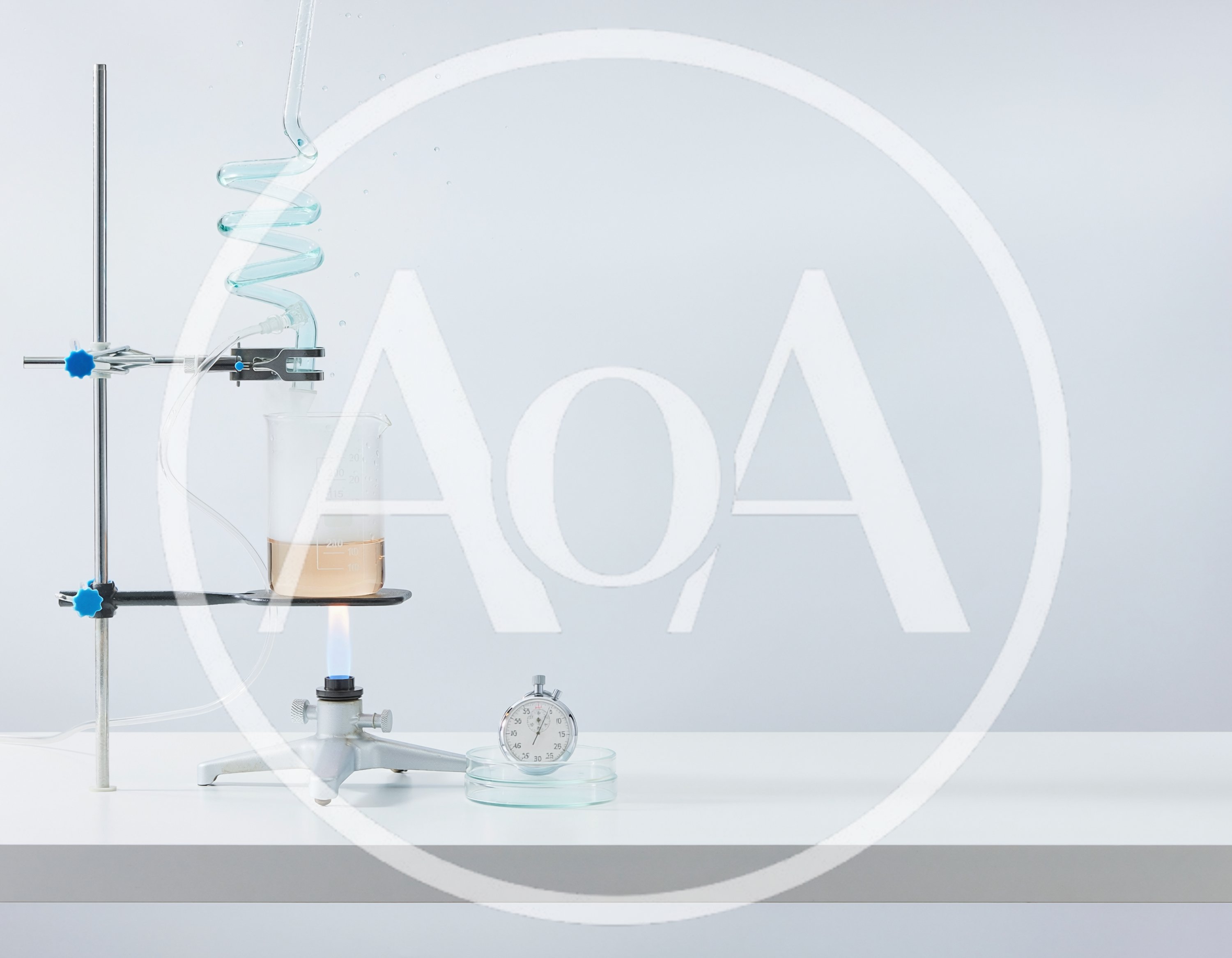 Laboratory Distillation Setup With Beaker And Stopwatch