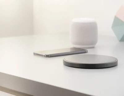 Wireless Charging Pad And Smartphone On Minimalist Desk