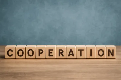 Wooden Blocks Spelling Cooperation On A Wooden Table