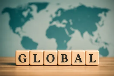 Wooden Blocks Spelling Global On A Wooden Surface