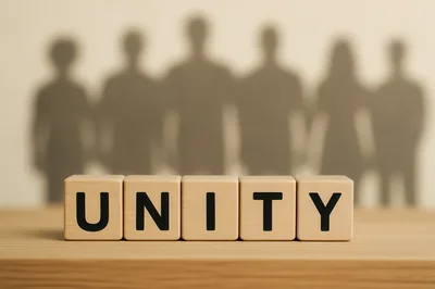 Wooden Blocks Spelling Unity With Human Silhouettes Background