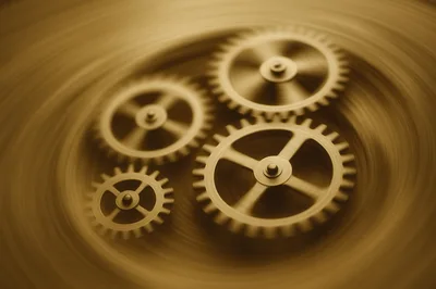 Close Up Of Rotating Brass Clockwork Gears