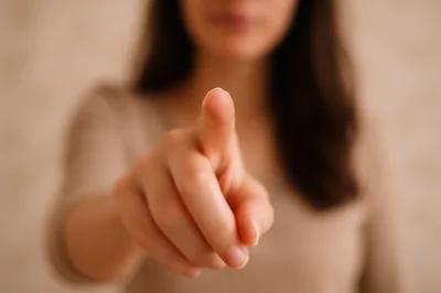 Woman Pointing Her Finger Directly At Camera