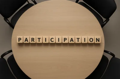 Wooden Blocks Spelling Participation On A Round Meeting Table