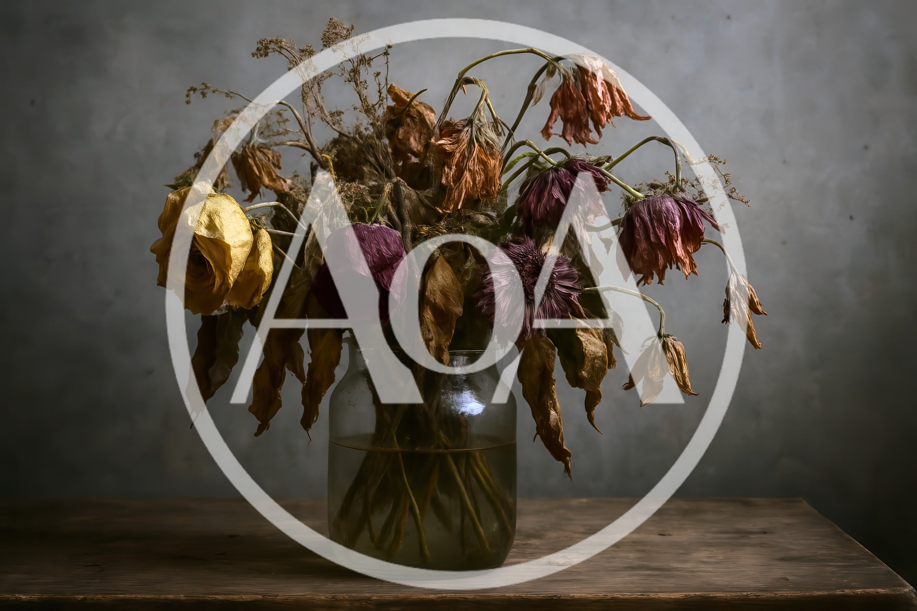 Dried Flowers In A Glass Jar On Wooden Table