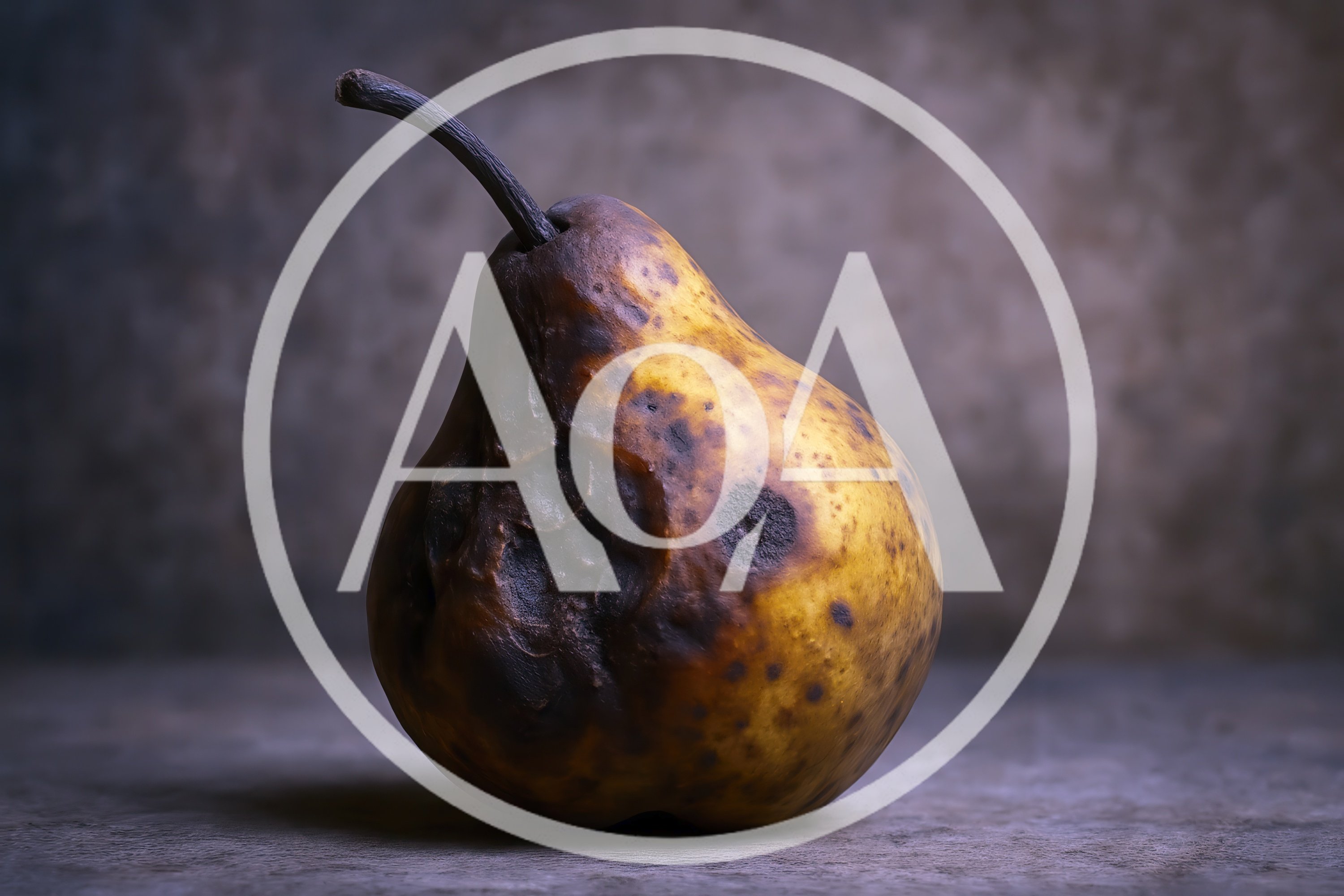 Single Decaying Pear On A Textured Surface