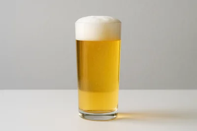 Glass Of Golden Lager Beer With Foam
