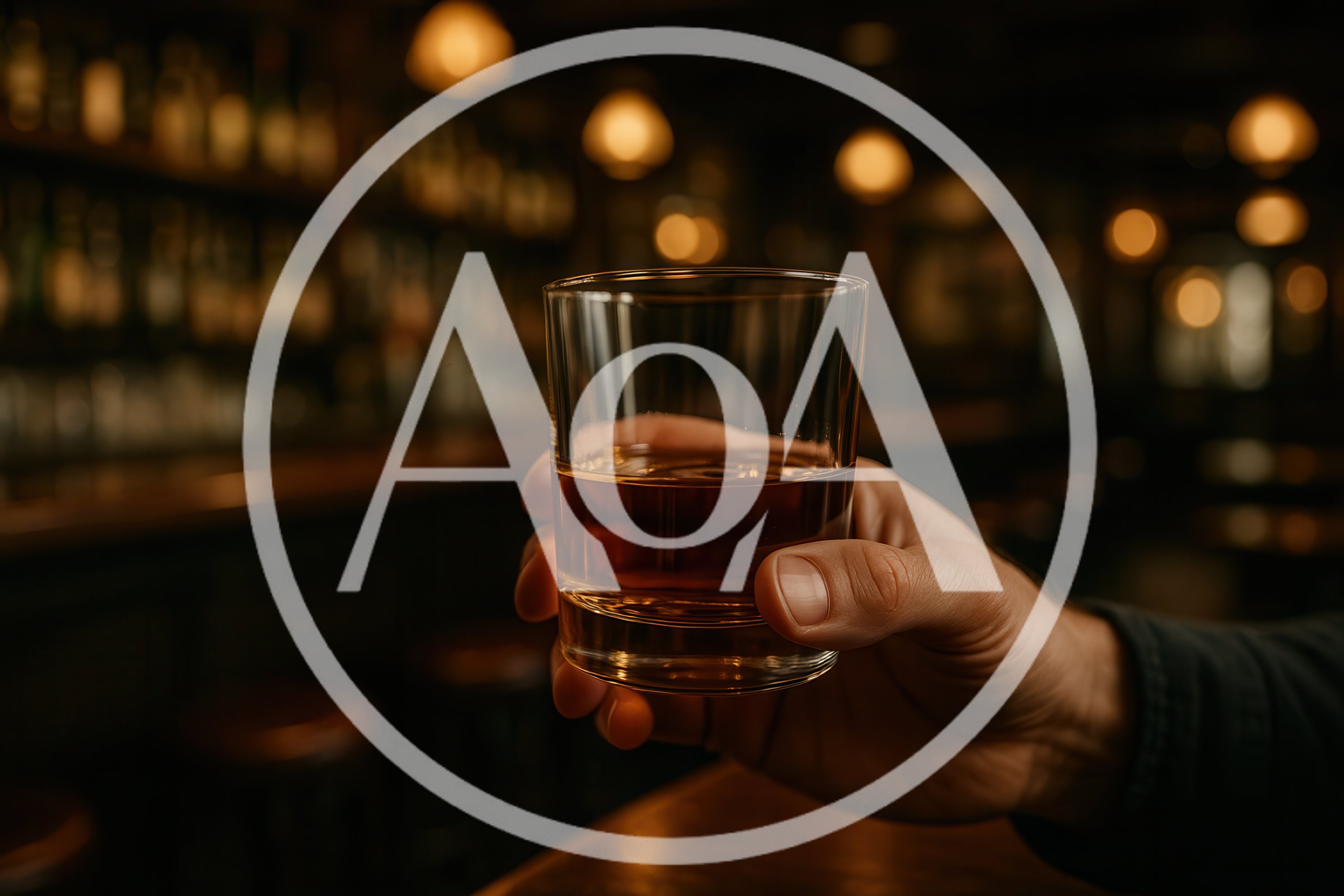 Hand Holding A Glass Of Whiskey In A Bar