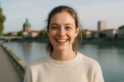 Young Woman Smiling Outdoors By A River