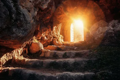 Ancient Stone Staircase Leading To A Bright Cave Entrance