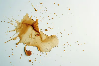 Brown Liquid Splatter On White Background