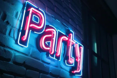 Neon Party Sign Mounted On A Brick Wall