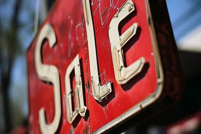 Close Up Of A Vintage Red Sale Sign