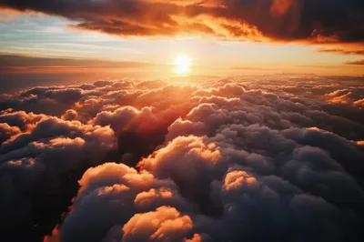 Aerial View Of Golden Sunset Above Dense Clouds