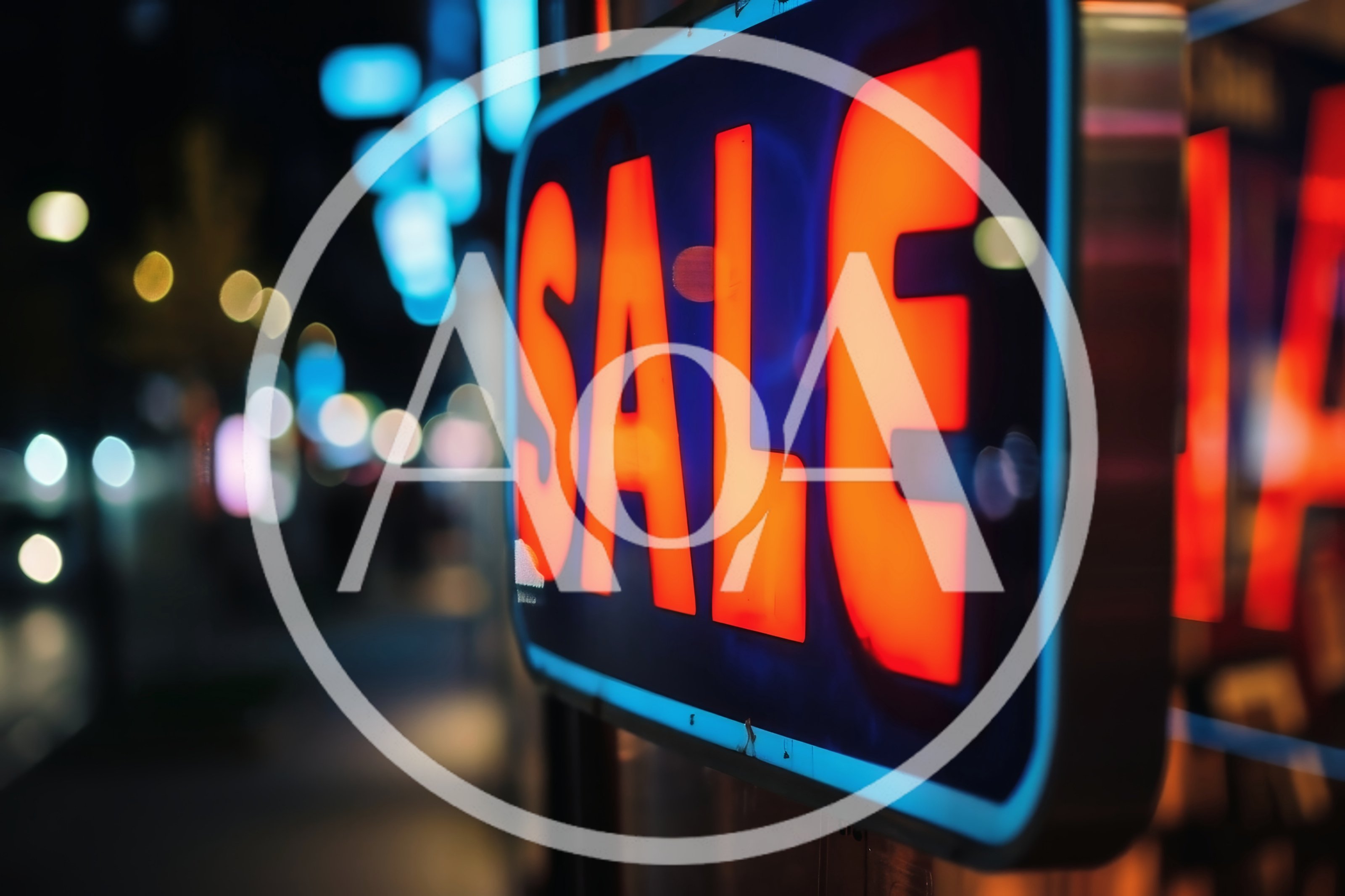 Neon Sale Sign Glowing In A City Street At Night