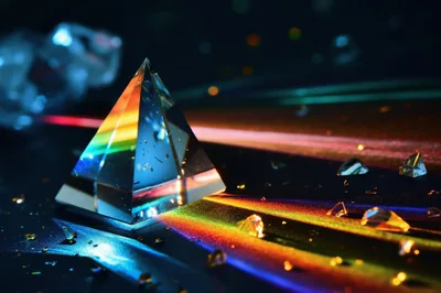 Glass Prism Refracting Light Into A Colorful Spectrum