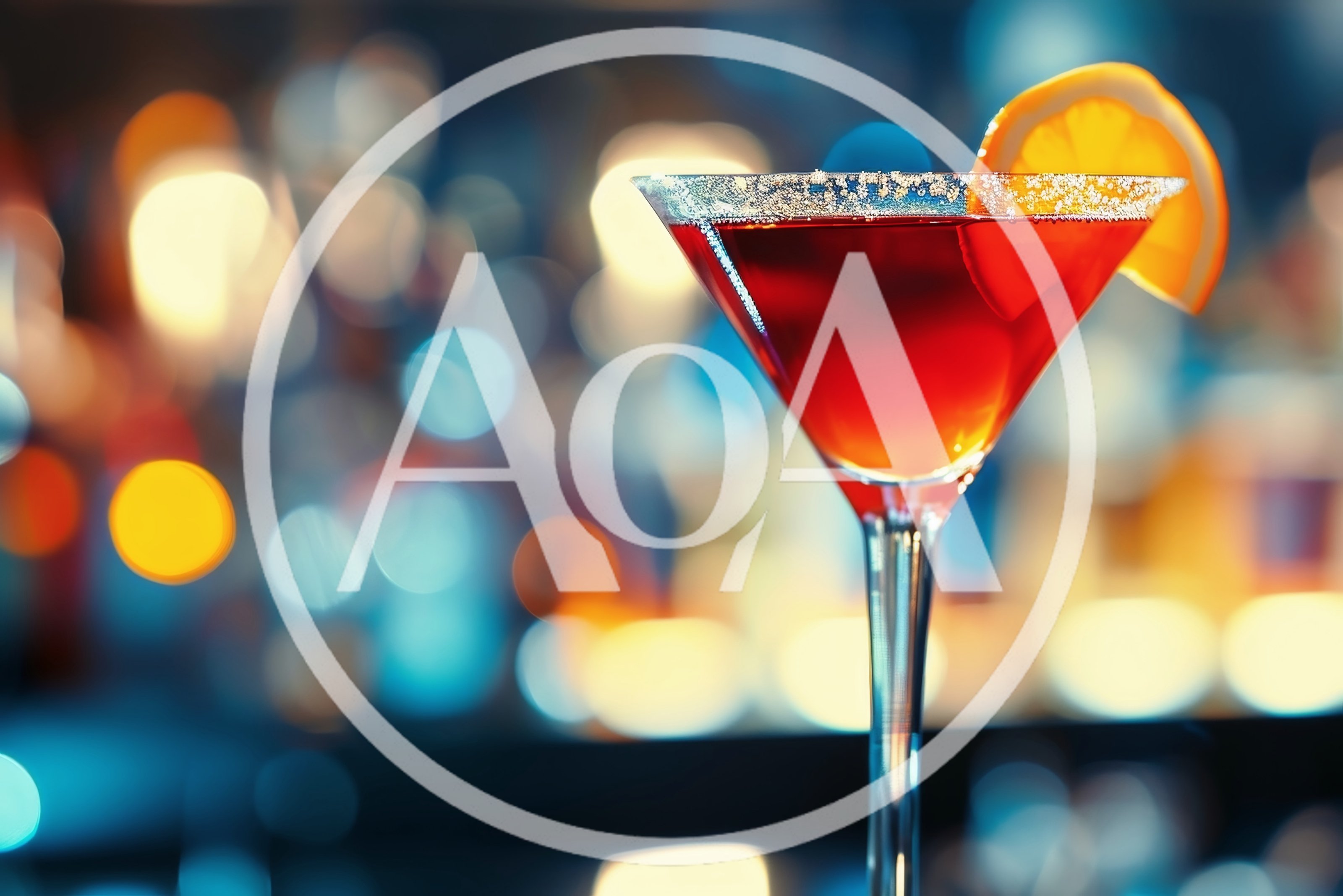 Red Cocktail In Martini Glass With Orange Garnish