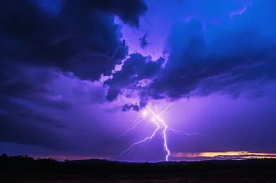 Dramatic Lightning Strike Over Dark Rural Landscape