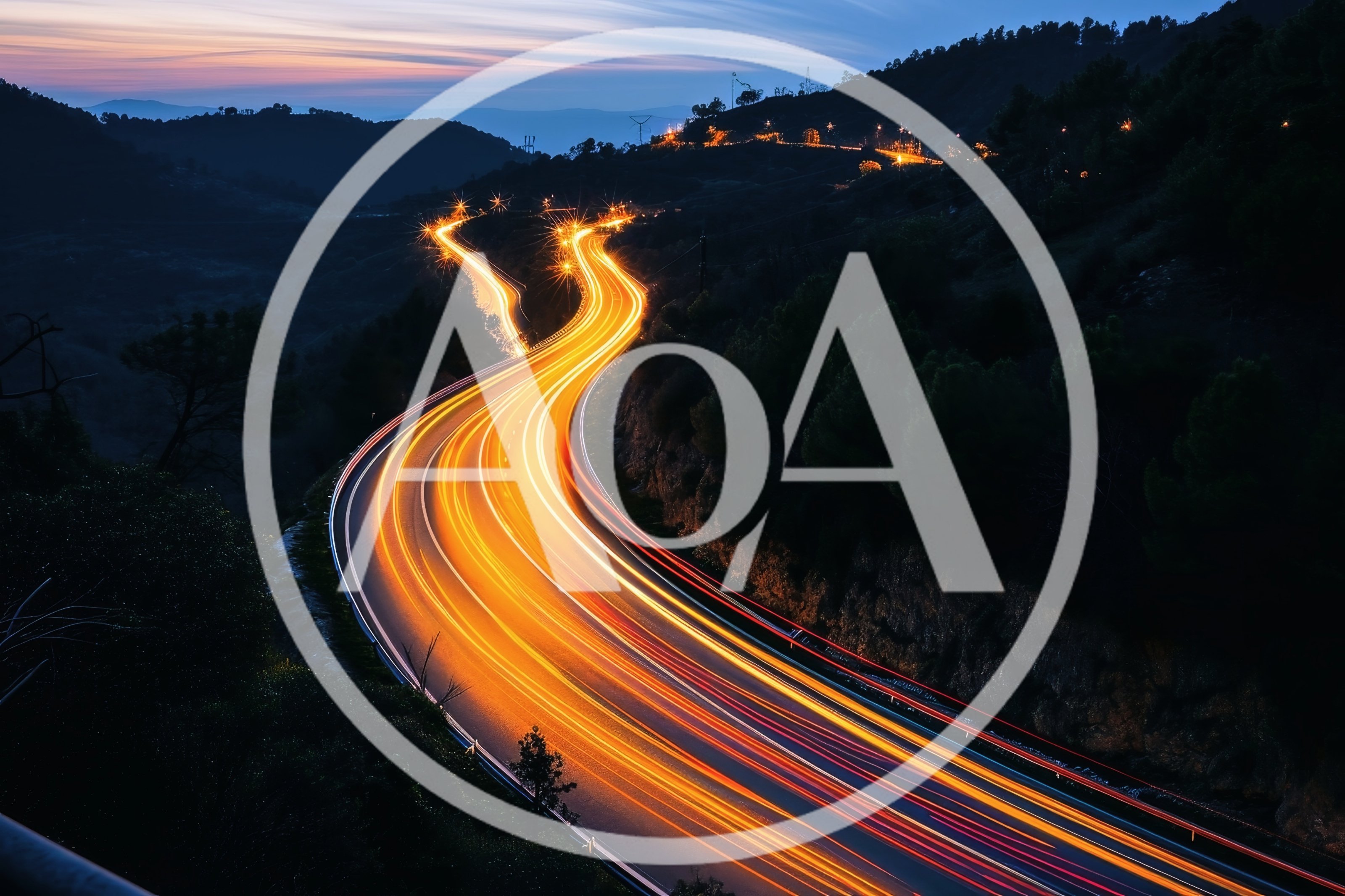 Long Exposure Light Trails On Winding Mountain Road