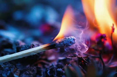 Burning Matchstick With Smoke And Vibrant Flames