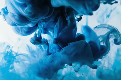 Blue Ink Swirling In Clear Water