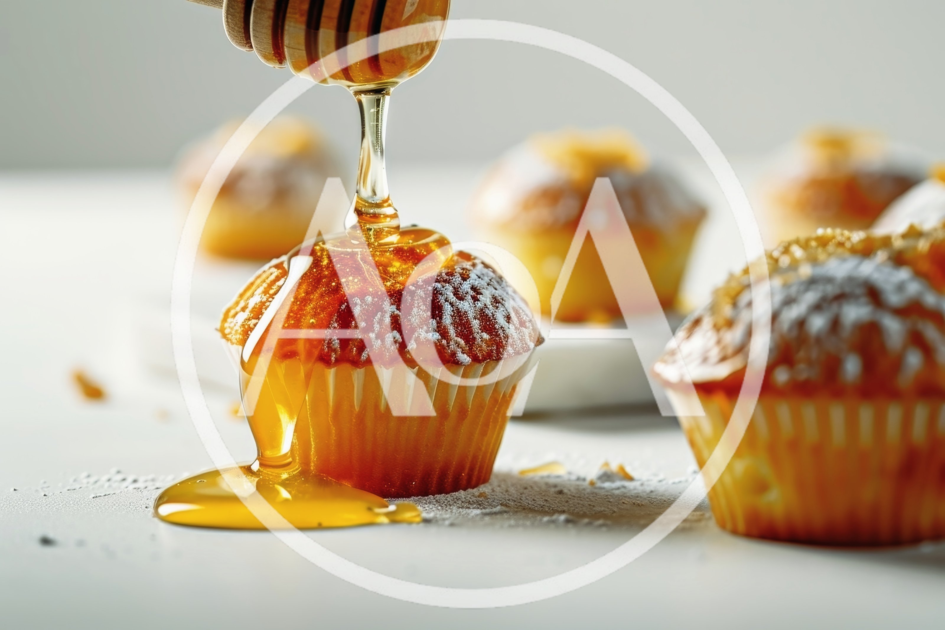Honey Drizzling Over Freshly Baked Muffins