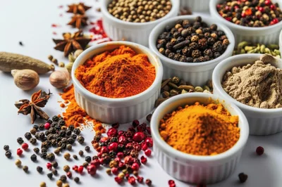 Assorted Spices and Powders in White Bowls