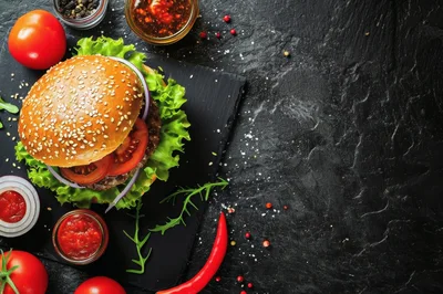 Gourmet Beef Burger With Fresh Vegetables On Slate
