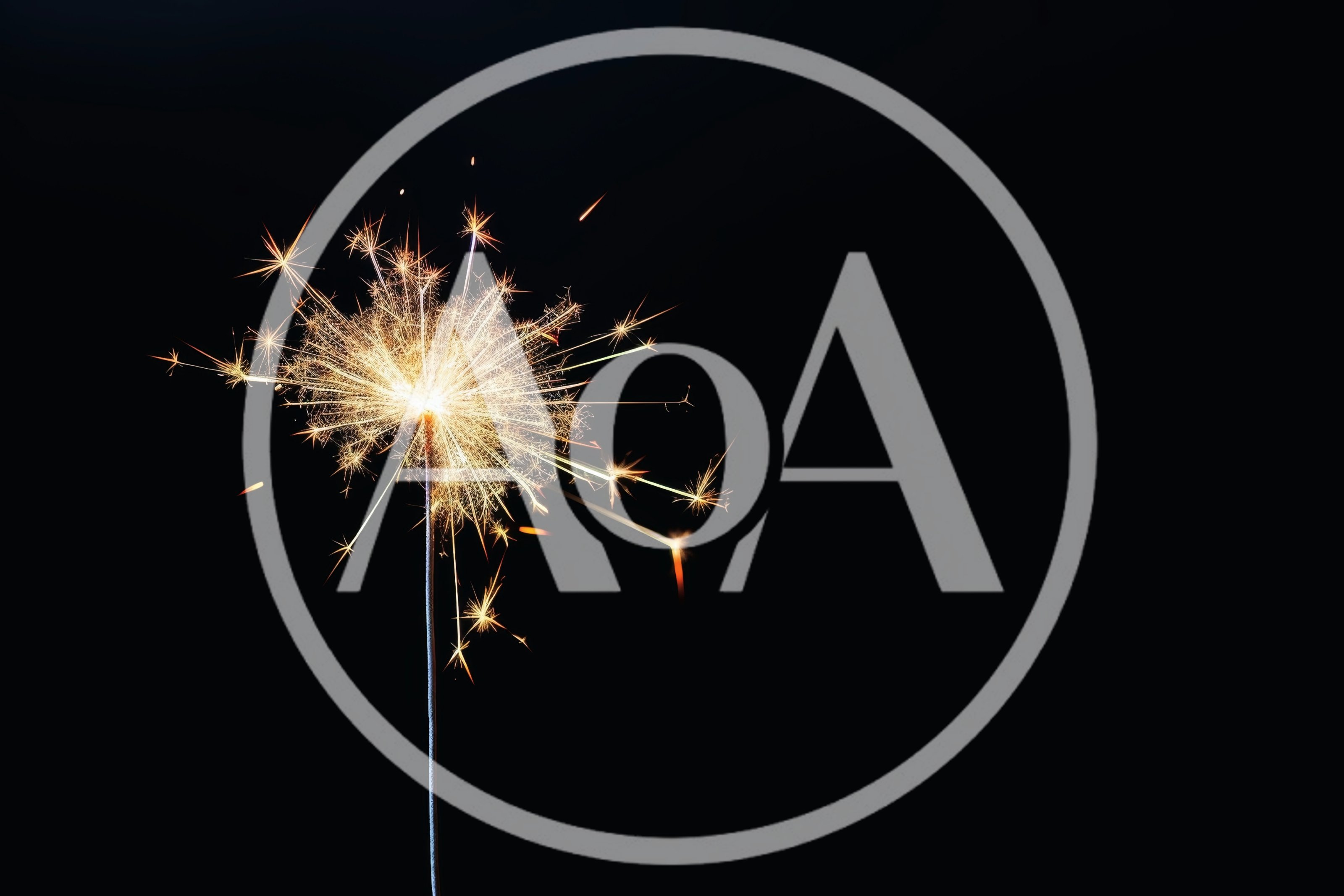 Bright Burning Sparkler Against A Solid Black Background